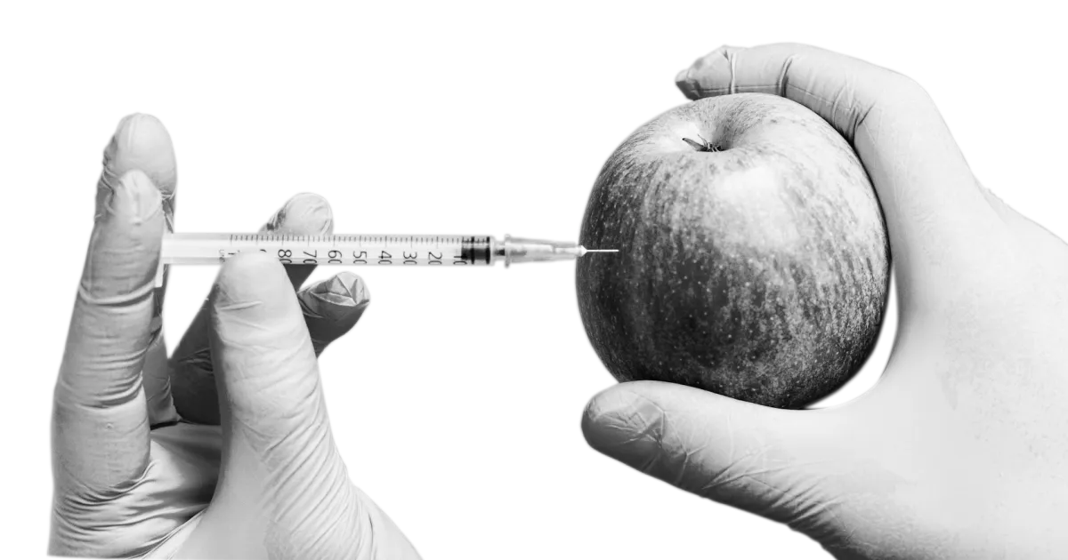an apple being injected with malware
